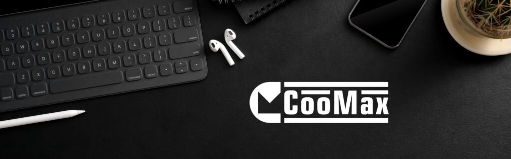 CooMax logo on a desk with a keyboard, wireless earphones and a phone.